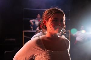 Woman smiling in Working: The Musical Theatre production.